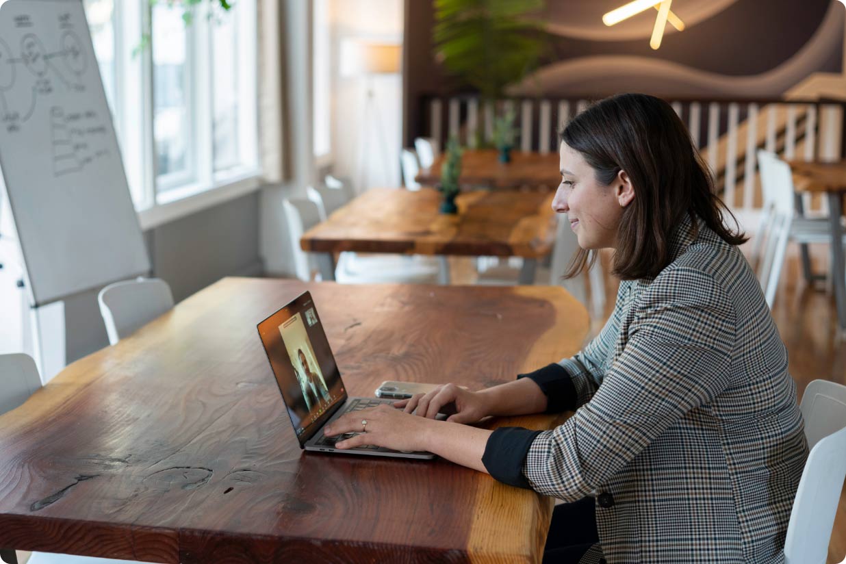 Young, professional woman working at a laptop